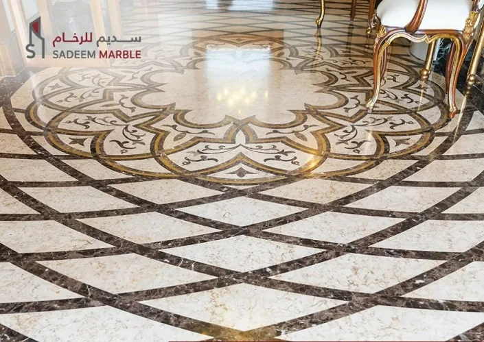 Ornate inlaid marble flooring design on display at the Sadeem Marble showroom